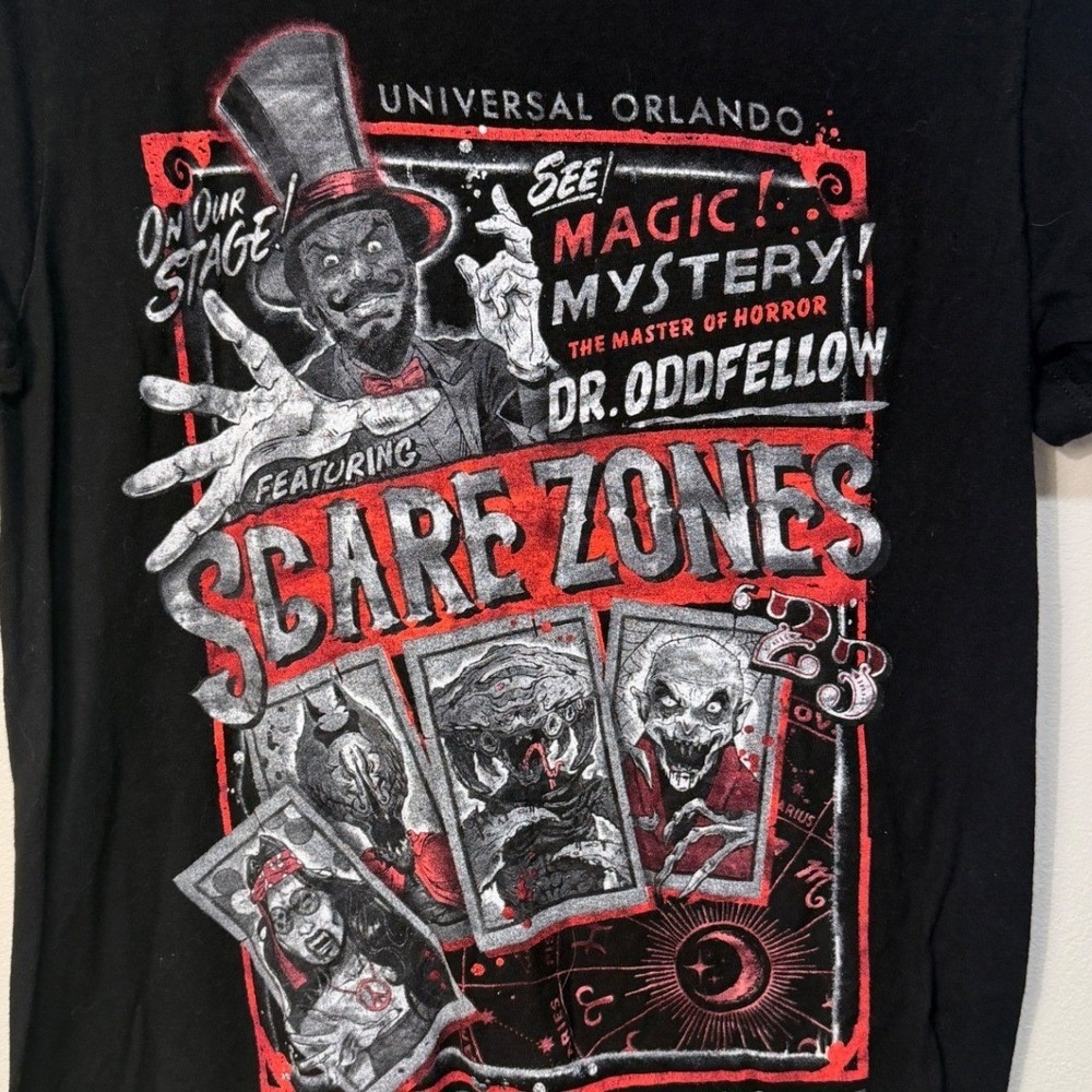 Halloween Horror Nights 2023 Sacre Zones Dr. Oddfellow T-Shirt Unisex S Black